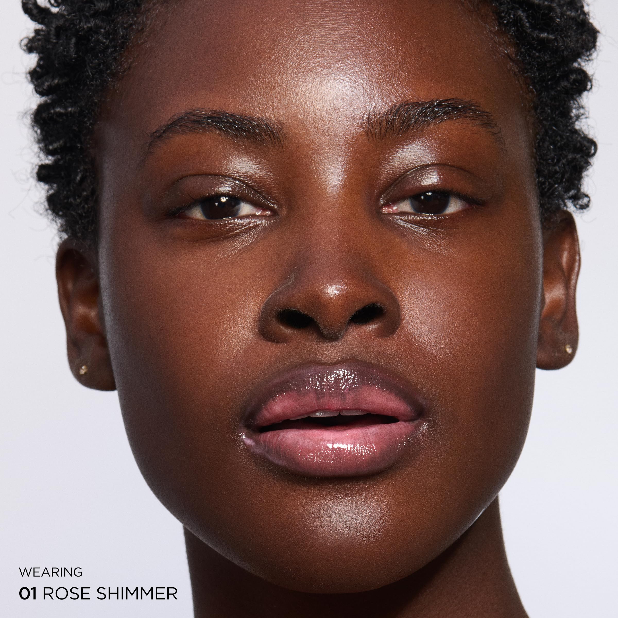 Clarins Natural Lip Perfector peptide plumping creates subtle fullness.