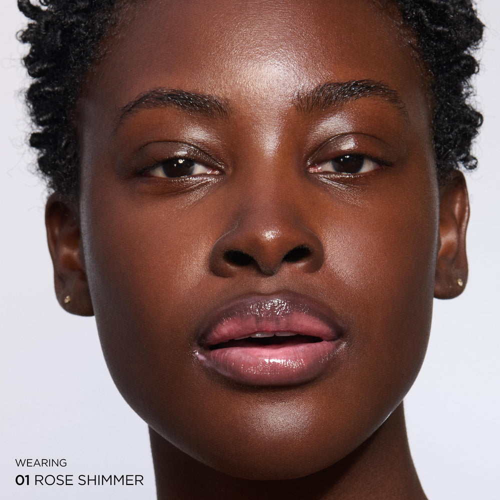 Clarins Natural Lip Perfector peptide plumping creates subtle fullness.