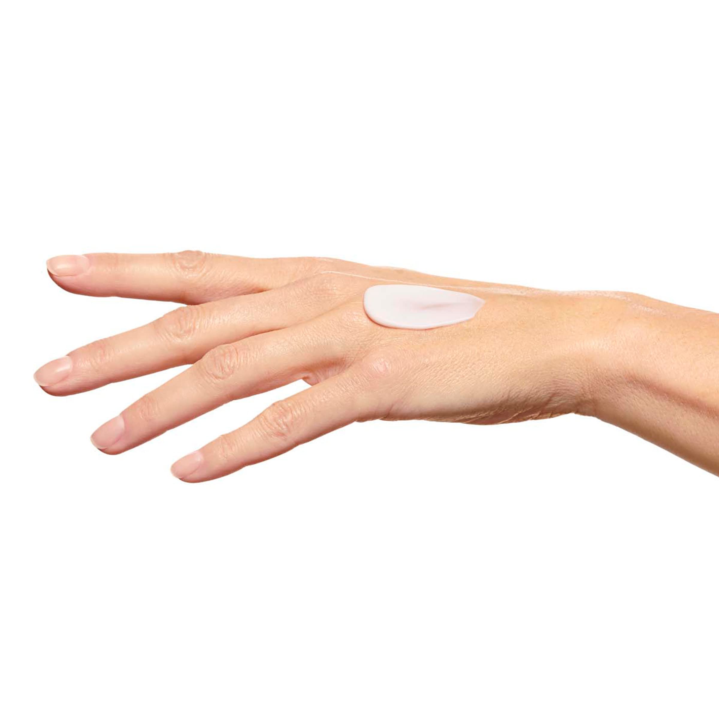 Clarins Super Restorative Hand Cream on display communicates daily luxury hand care.