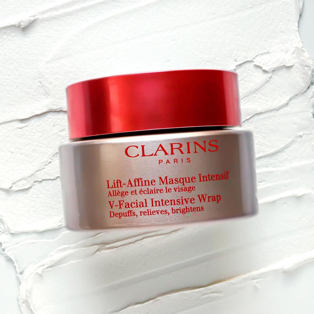 Clarins V-Facial Intensive Wrap Mask applied to cheek area for quick use scenario
