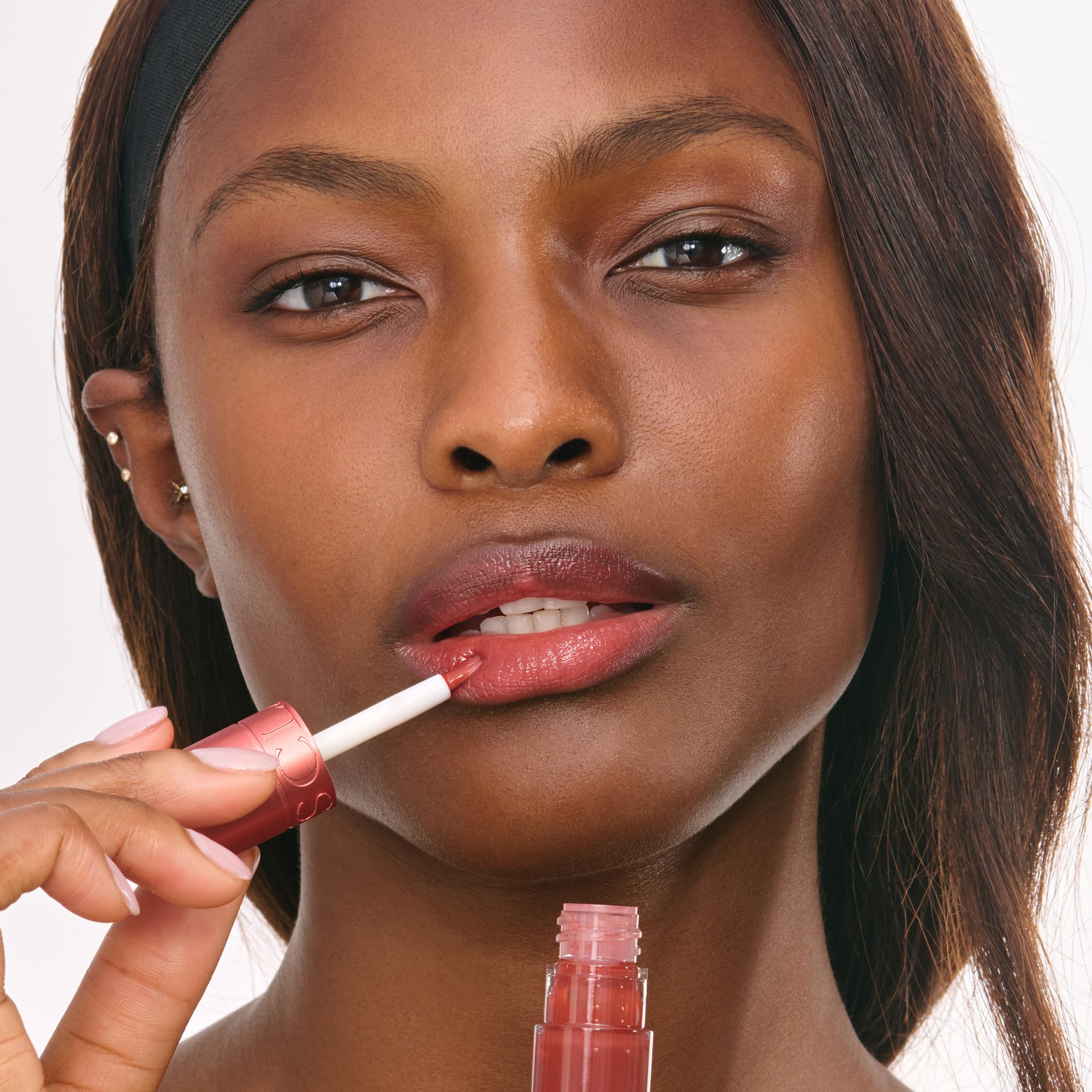 Clarins Water Lip Stain on lips with a matte finish.