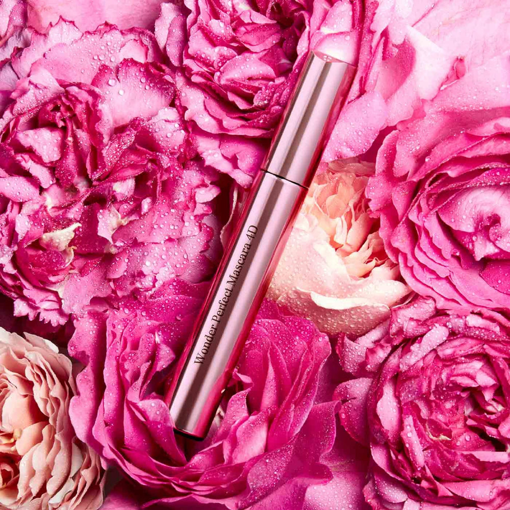 Lashes curl and hold shape with Clarins Wonder Perfect Mascara for volume.