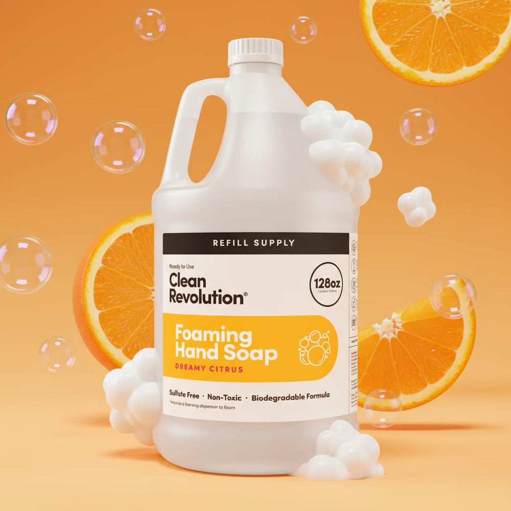 Pour action of Clean Revolution Dreamy Citrus refill bottle into dispenser