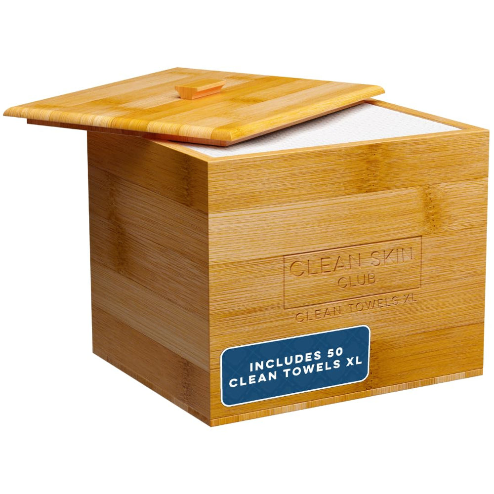 Clean Skin Club Luxe bamboo container on a bathroom counter with removable cover