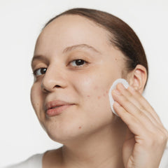 Clinique Acne Solutions Clarifying Lotion packaging front highlights five skin-type formulas.
