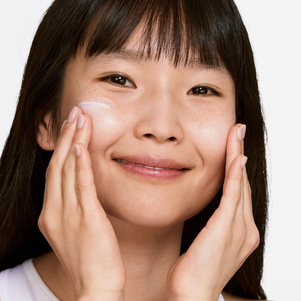 Application scene of Clinique Even Better Brightening moisturizer on skin for even tone.
