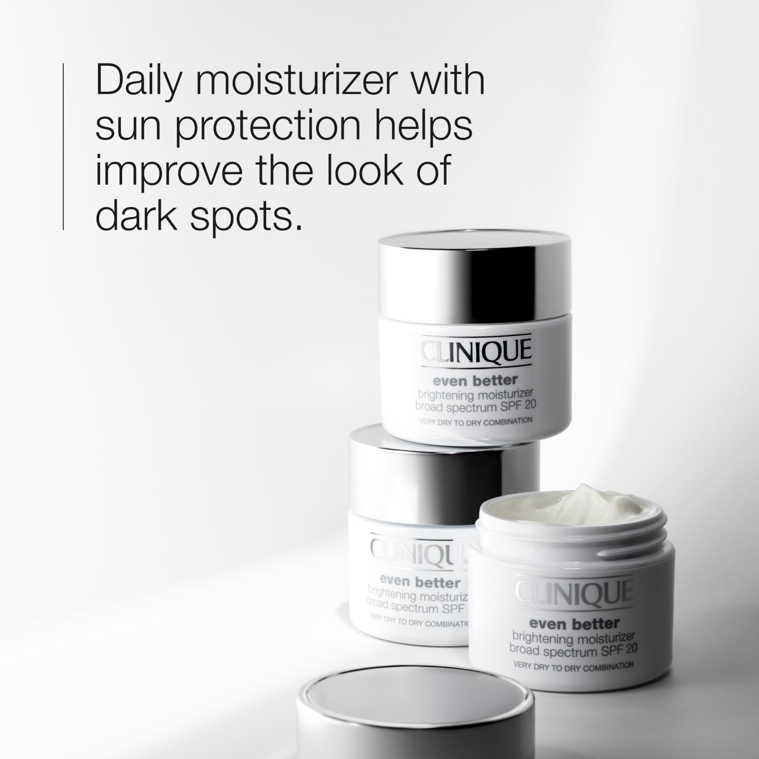 Clinique Even Better Brightening moisturizer pump showing creamy, oil-free texture for dry skin.
