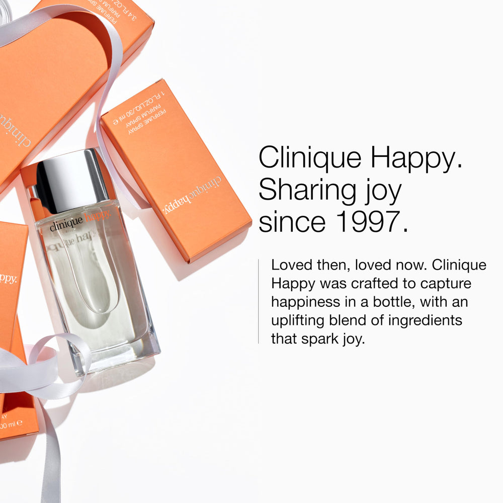 Spritz of Clinique Happy on skin showing instant freshness for daytime wear
