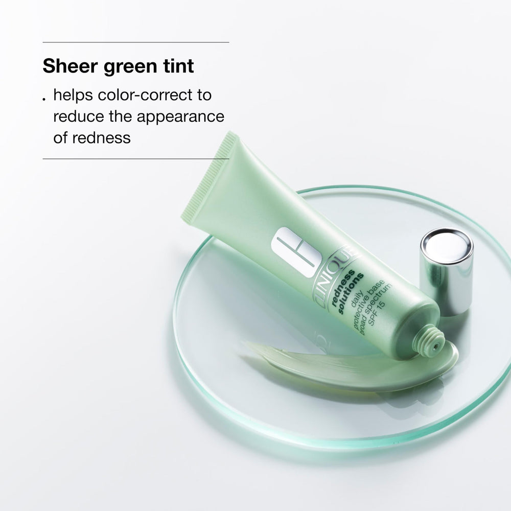 Close-up of Clinique Redness Solutions base applying green tint for seamless color correction.