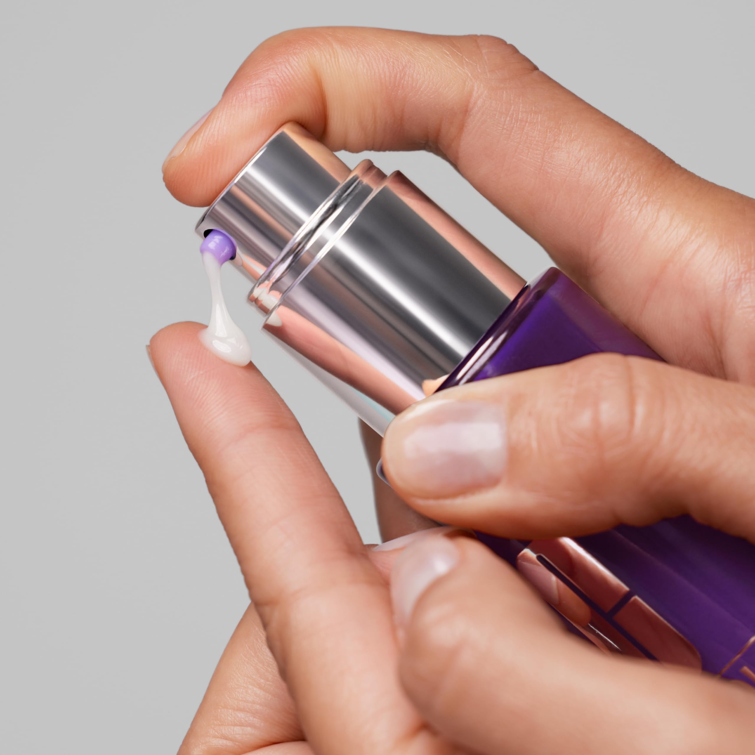 Hands applying Clinique Smart serum in a quick daily routine.