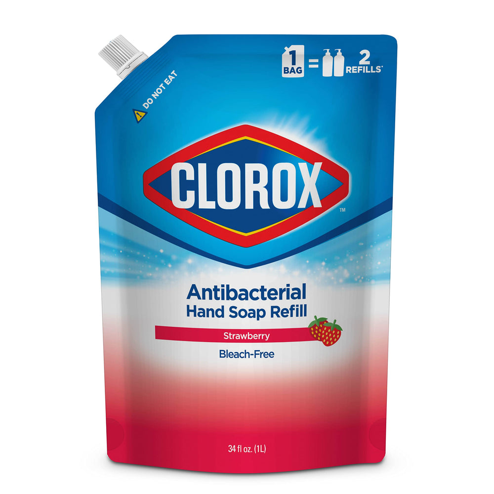 Clorox hand soap refill pouring into a dispenser with strawberry scent.