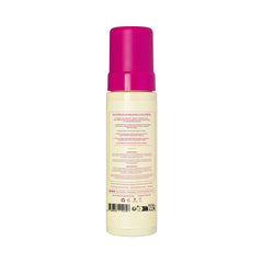 Coco & Eve bronzer mitt applying mousse for smooth, even coverage.