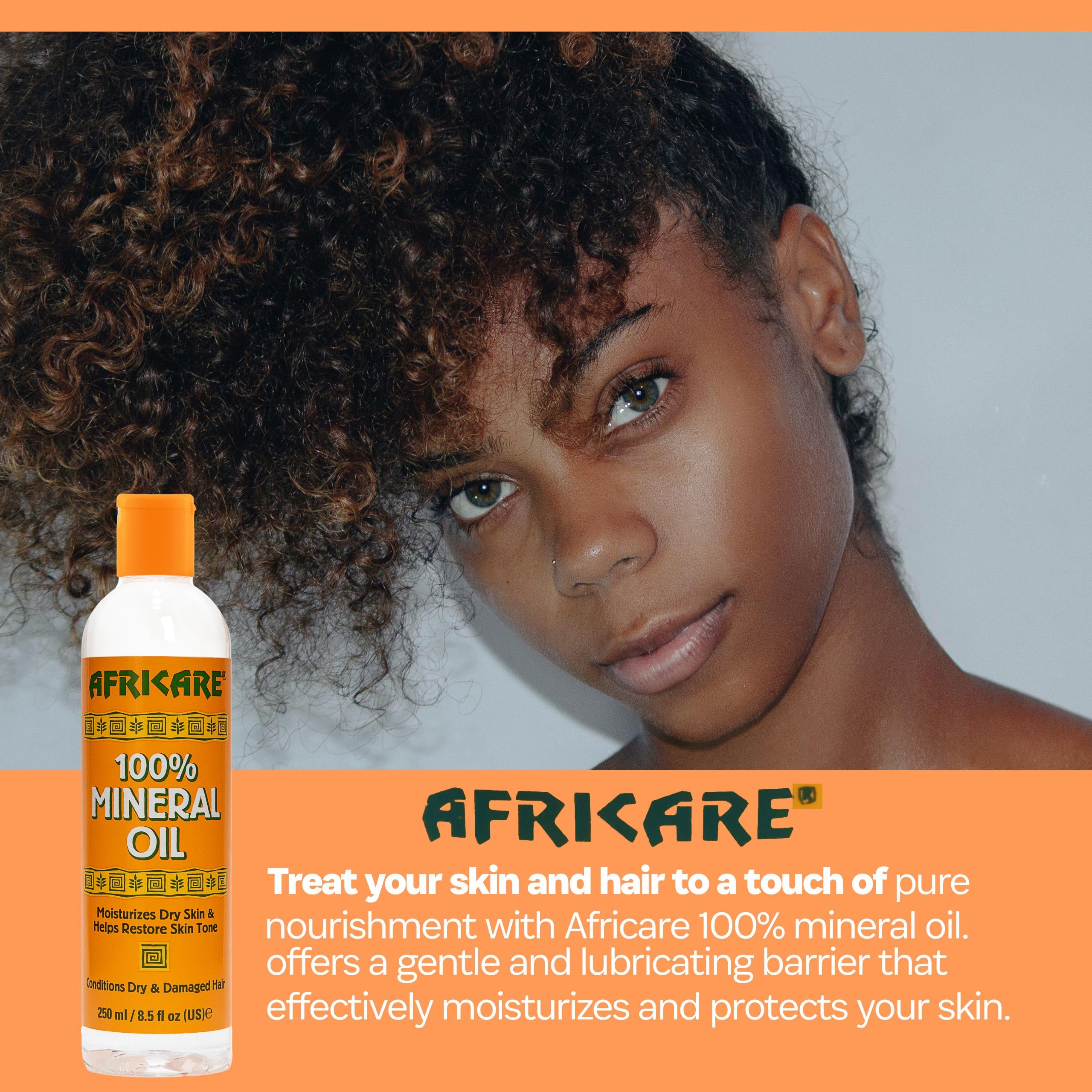 COCOCARE Africare mineral oil applied to hands for smooth, hydrated skin