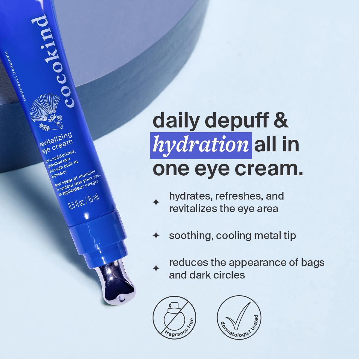 Close-up of applying Cocokind eye cream with cooling metal tip on the under-eye area