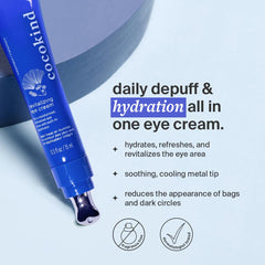 Close-up of applying Cocokind eye cream with cooling metal tip on the under-eye area