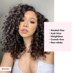 Dream Coat spray evenly coats curl strands for frizz control.