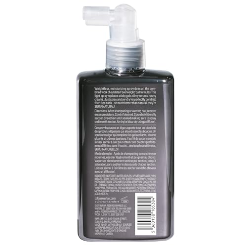 Dream Coat spray applied to curly hair for defined shine.