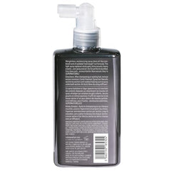 Dream Coat spray applied to curly hair for defined shine.