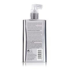 Dream Coat being sprayed on damp hair for even coverage