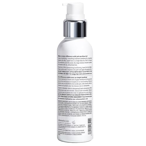 Color Wow Dream Cocktail bottle pour captured for easy product dispersion during styling.