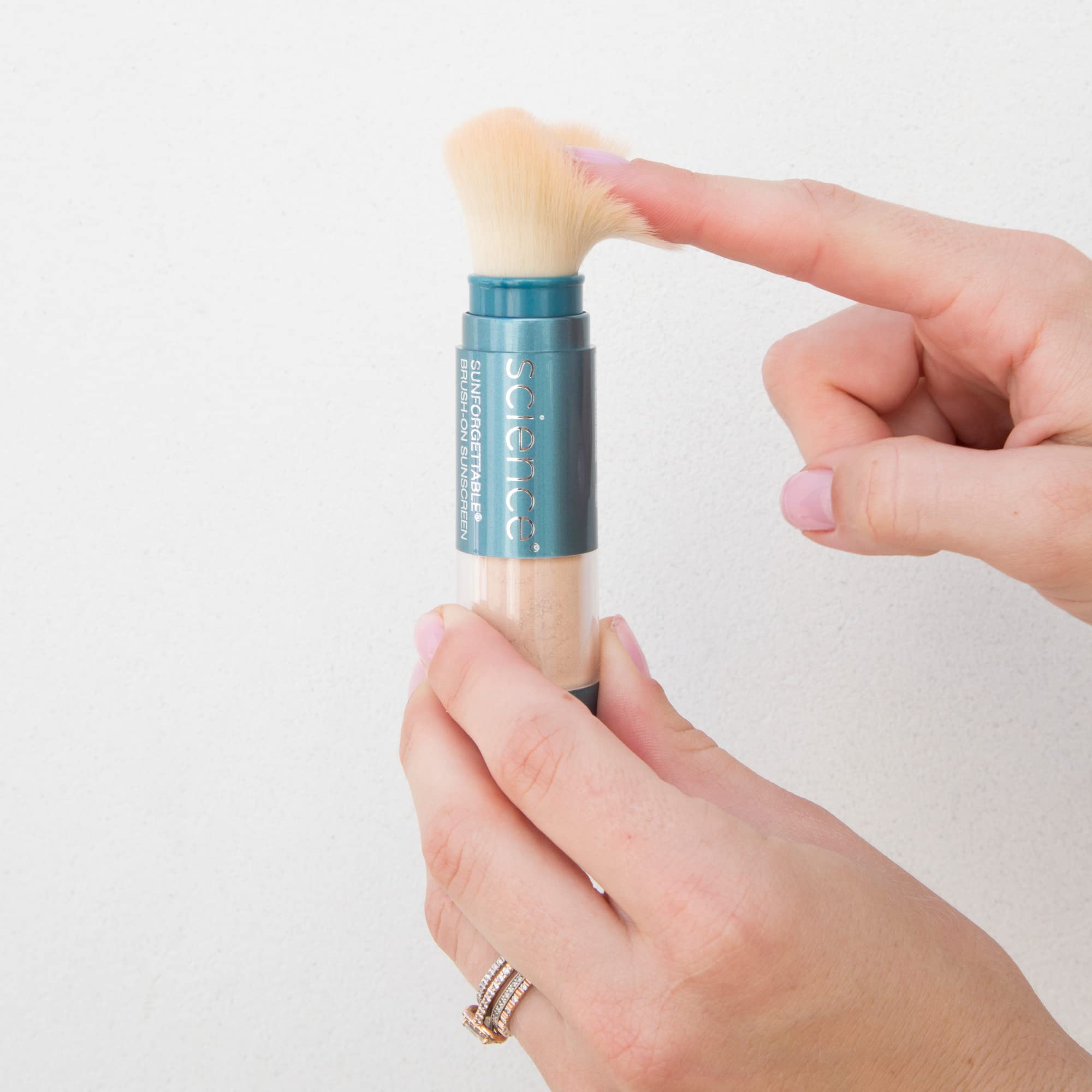 Colorescience brush-on sunscreen SPF50 mineral filters visible on package