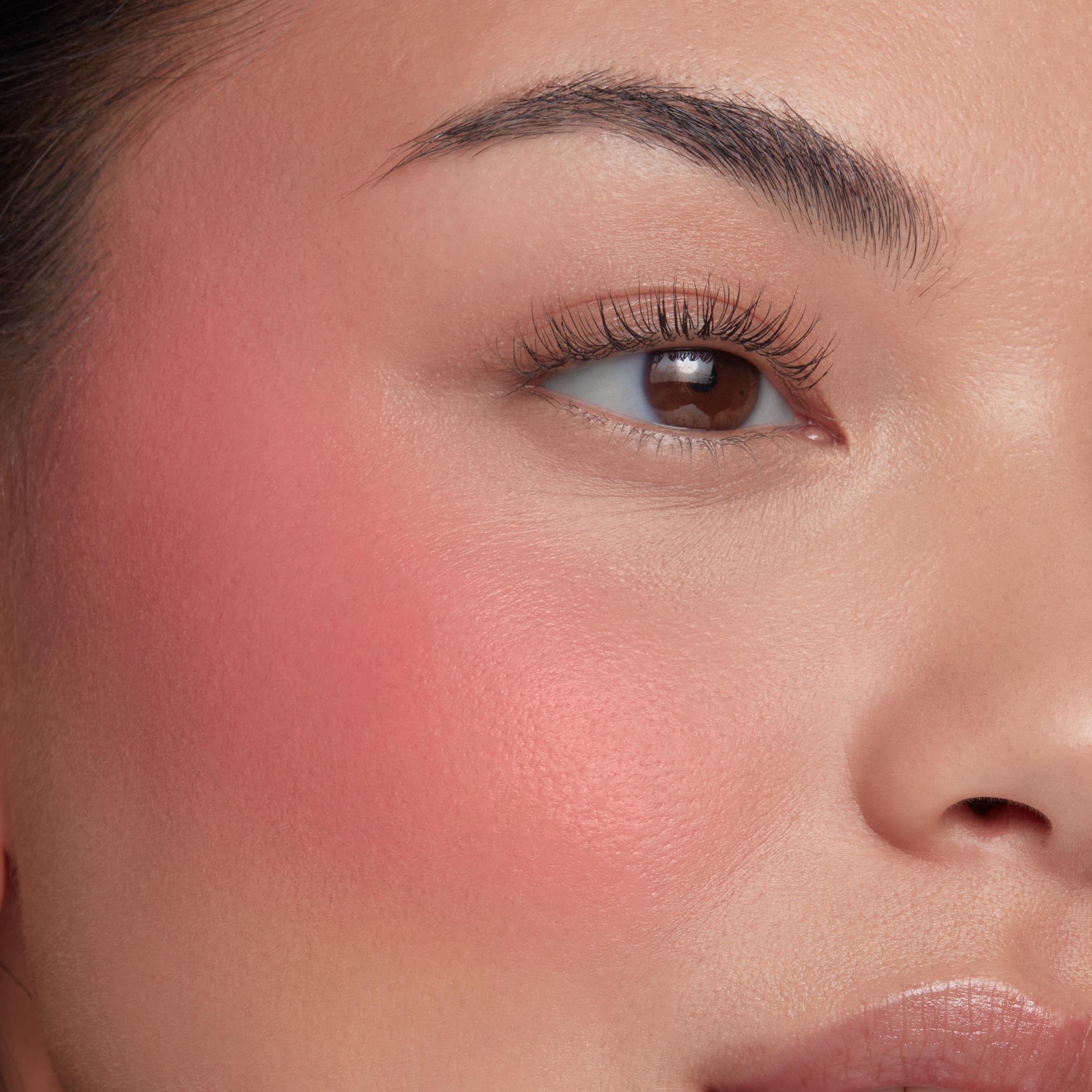 Swatch shows buildable, dewy glow from ColourPop Weightless Liquid Blush.