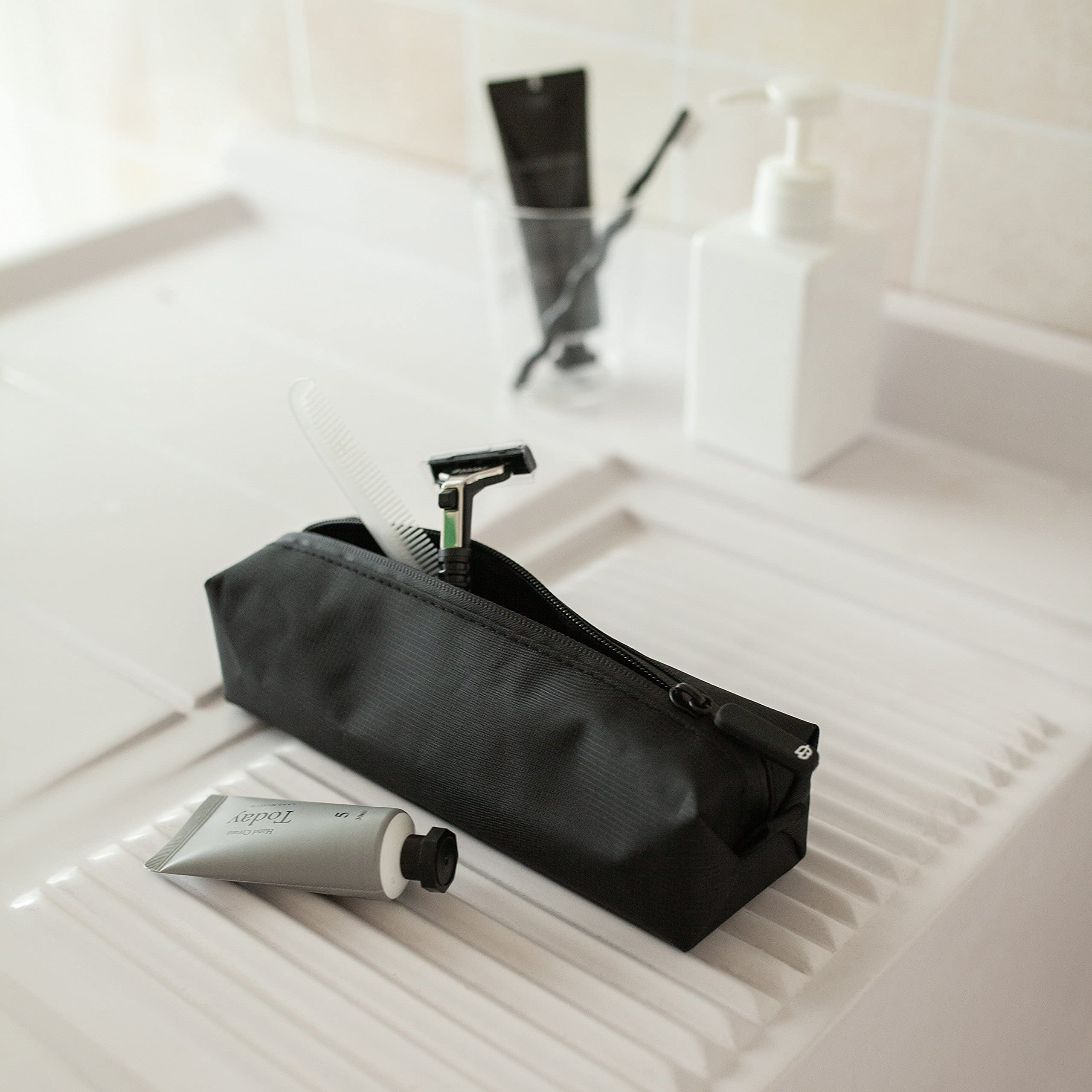 Comfyable small toiletry bag long-items-fit design accommodates longer items.
