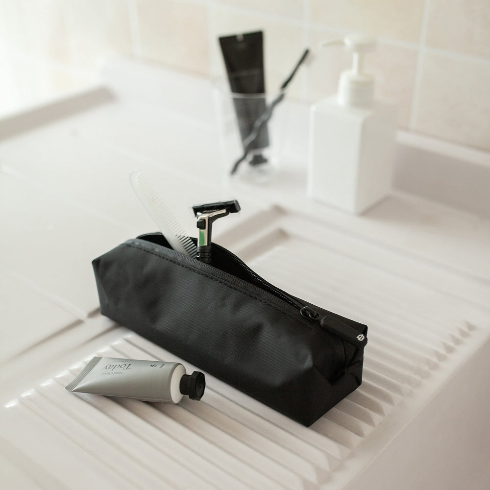 Comfyable small toiletry bag long-items-fit design accommodates longer items.