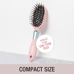 Ball-tipped bristles glide through hair with less snag in the Conair Velvet Touch Brush.