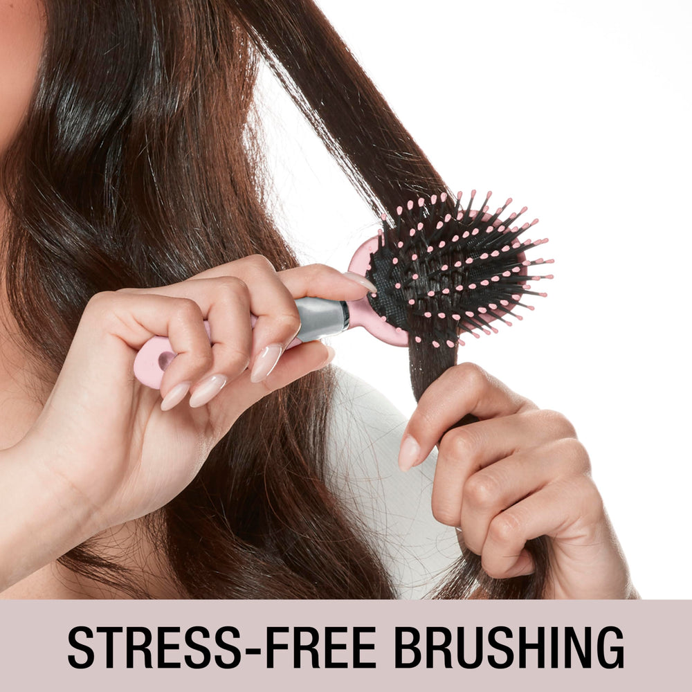 Conair Velvet Touch Brush in use, perfect for quick detangling at home or while traveling.