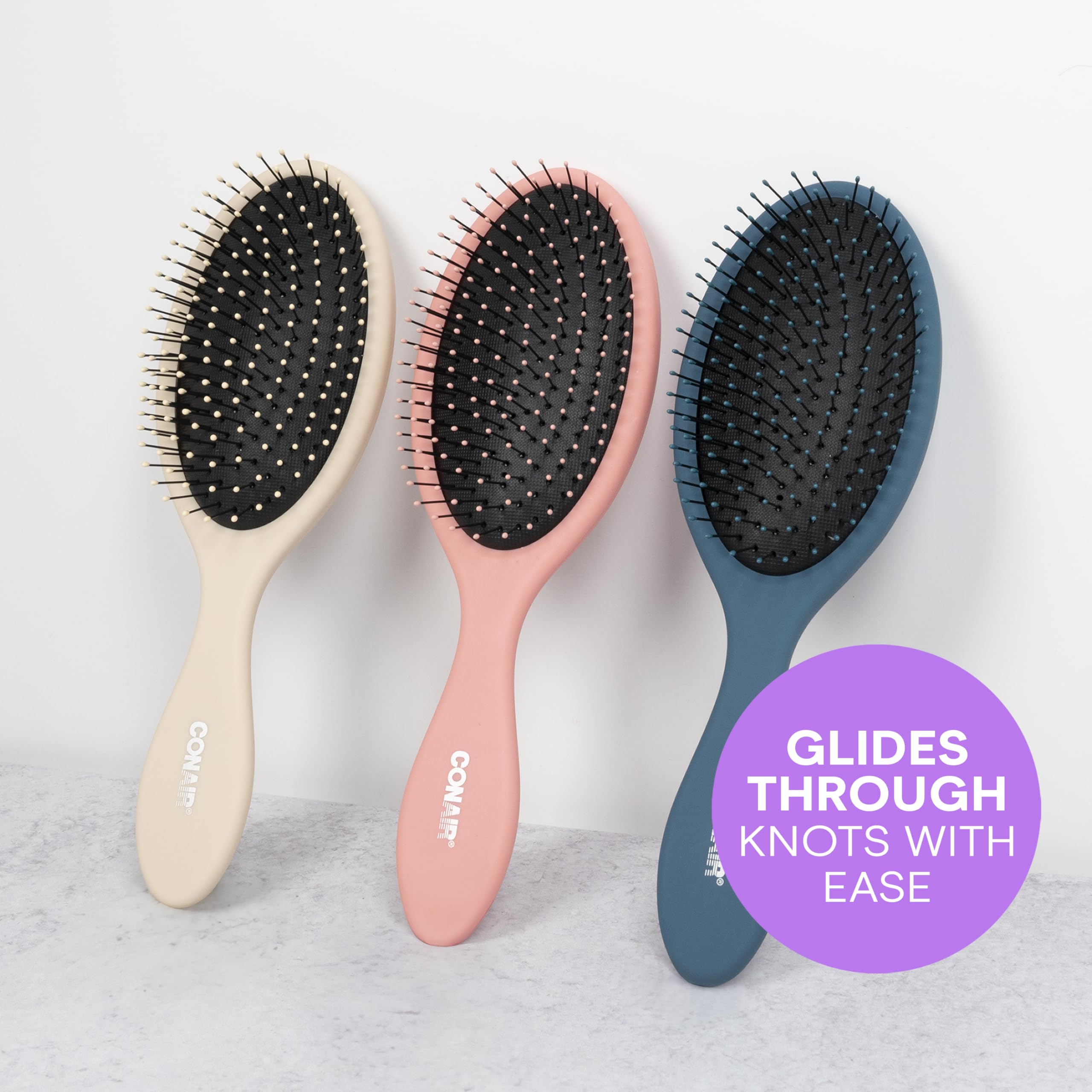 Three-pack Detangler brushes from Conair ready for quick styling touch-ups.