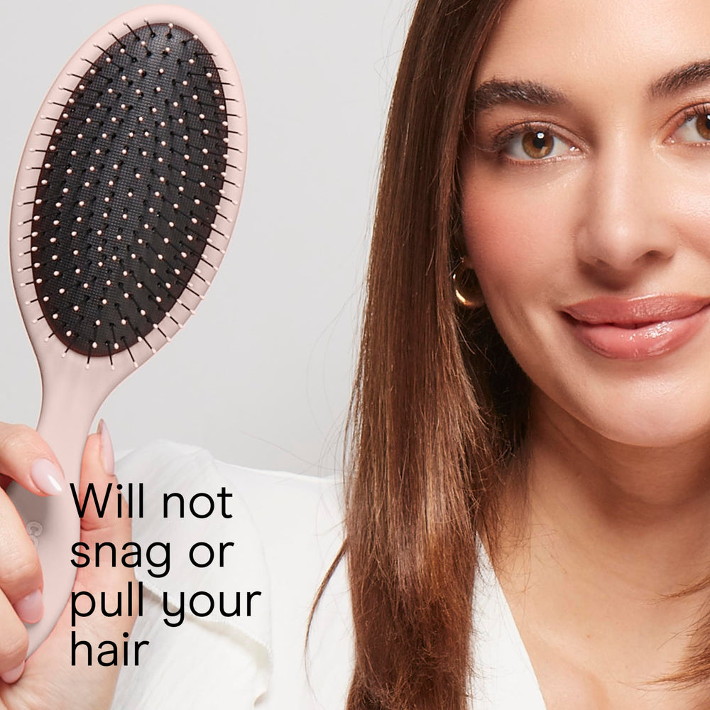 Cushioned base design reduces tugging during detangling.