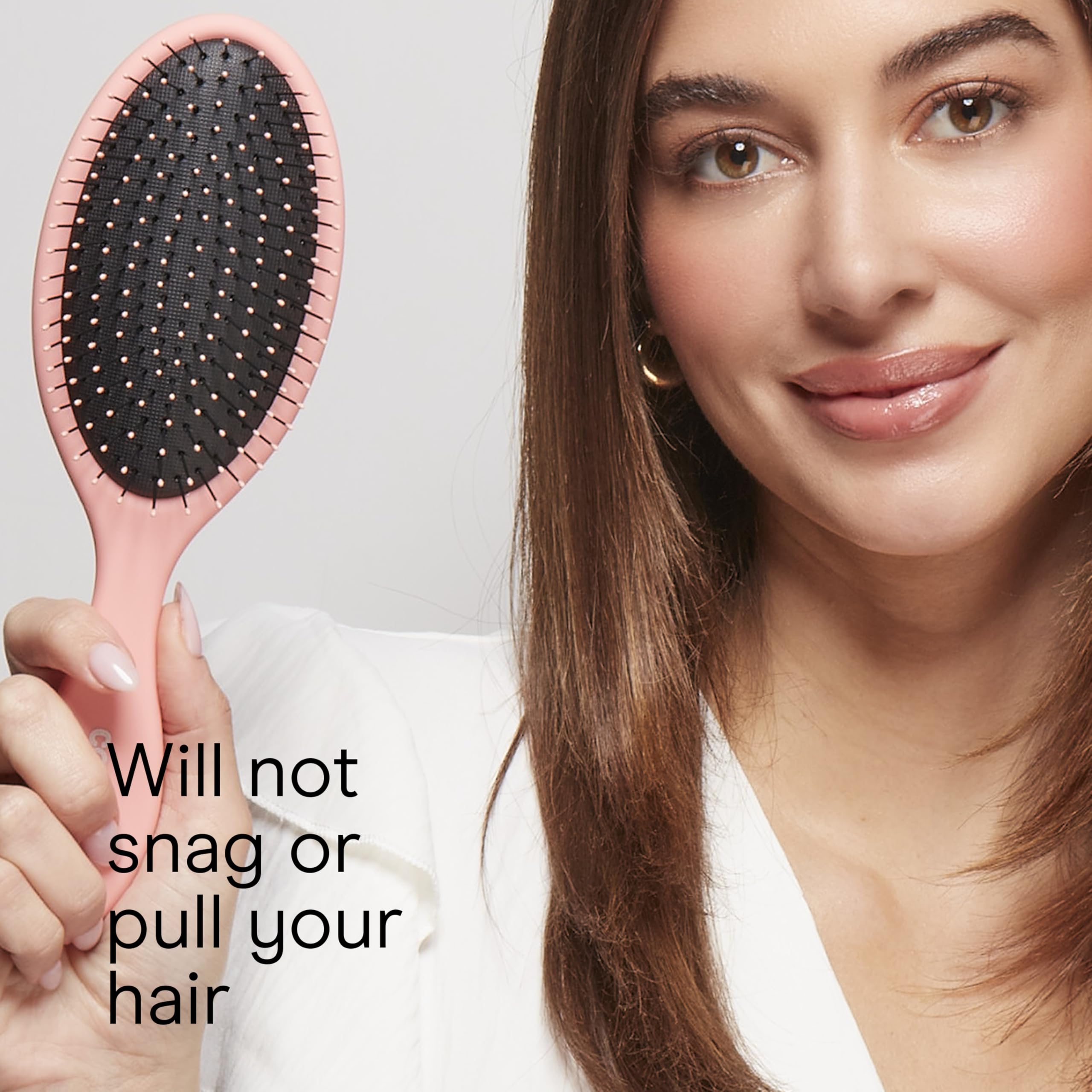 Conair Detangling Brush with easy-grip handle for better control.