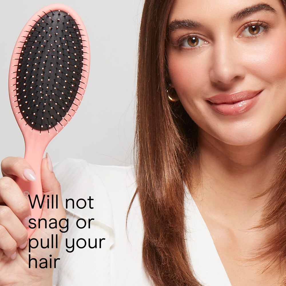 Conair Detangling Brush with easy-grip handle for better control.