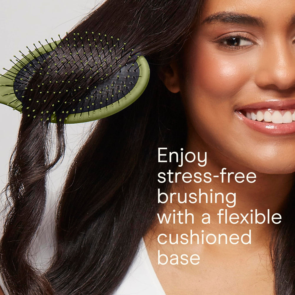 Conair Detangling Brush Set on dry hair smooths knots gently.