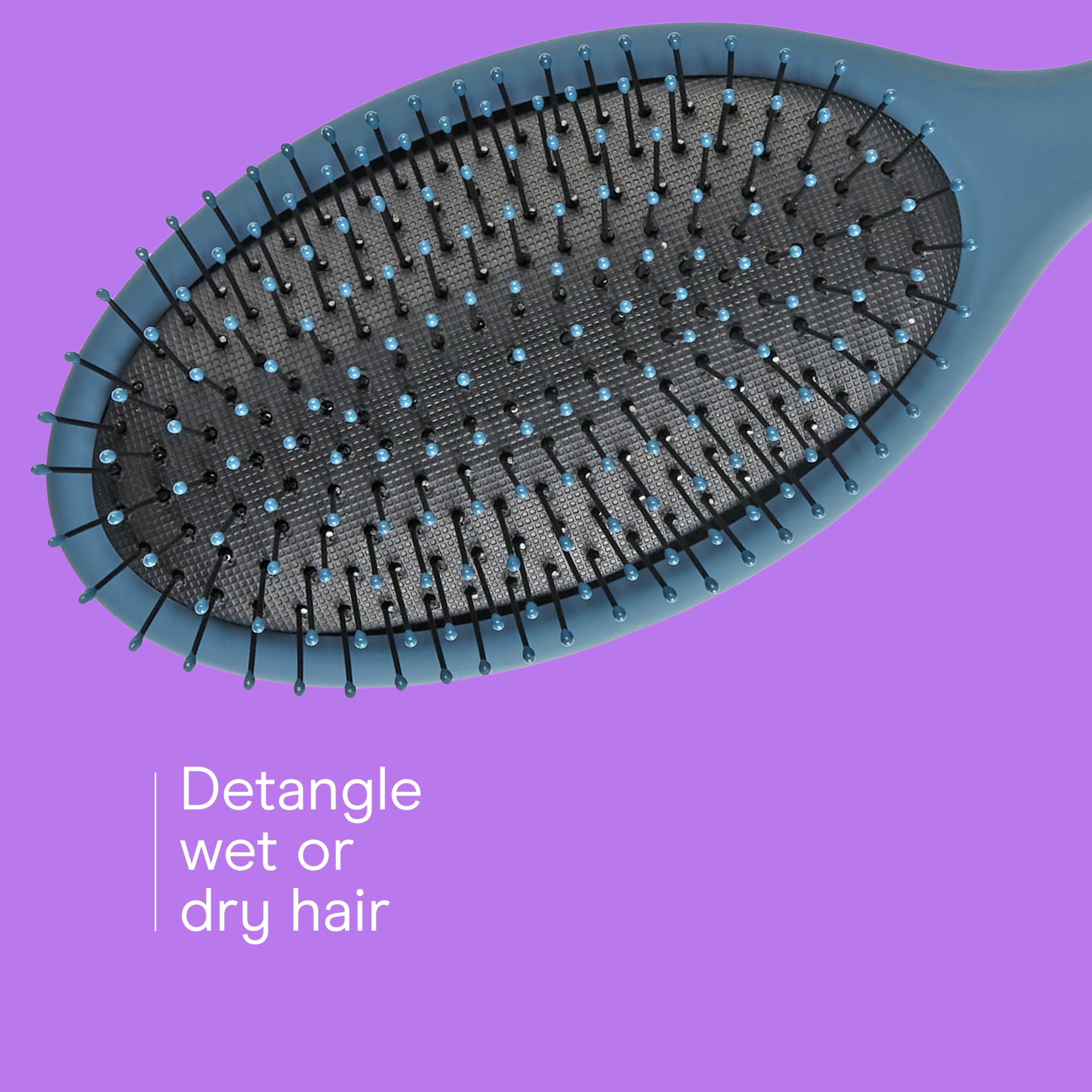Conair Detangling Hair Brush Set in coral eases knots during styling.