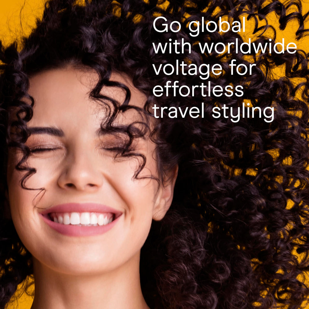 Conair ¾-inch curling iron in-use on short hair creating tight curls.