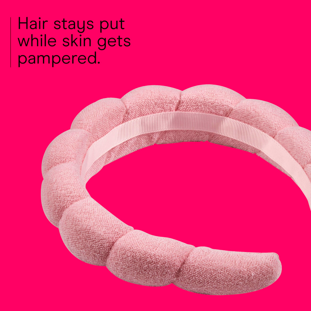 Conair headband with no-squeeze, no-pull design protects hair while applying makeup.
