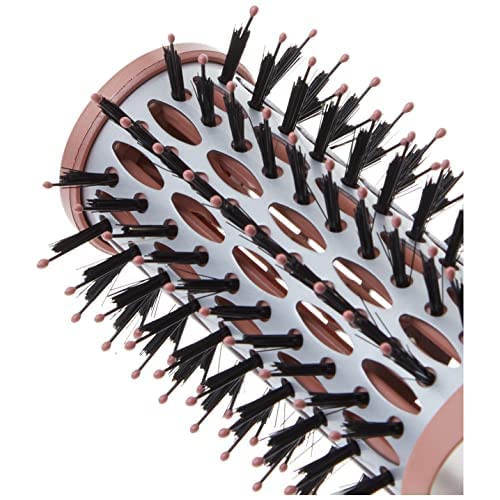 User holds brush with nylon and ball-tipped bristles for comfortable control.