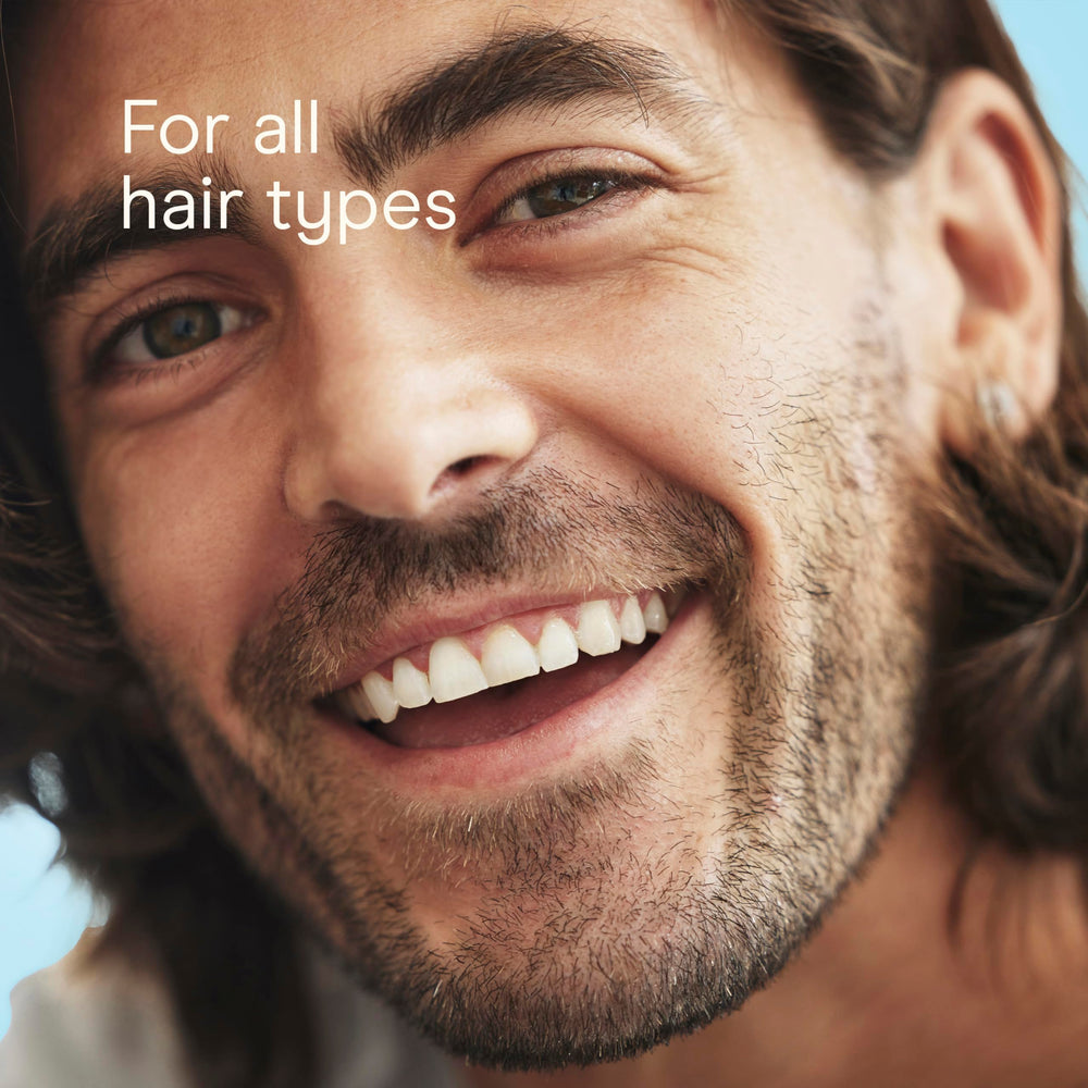Conair Men brush in sleek black finish for daily grooming.