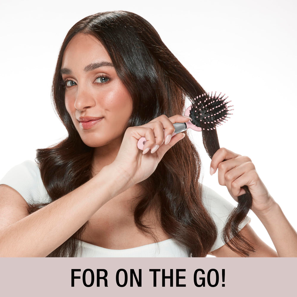 Demonstration of the cushion base reducing pull during brushing on various hair types.