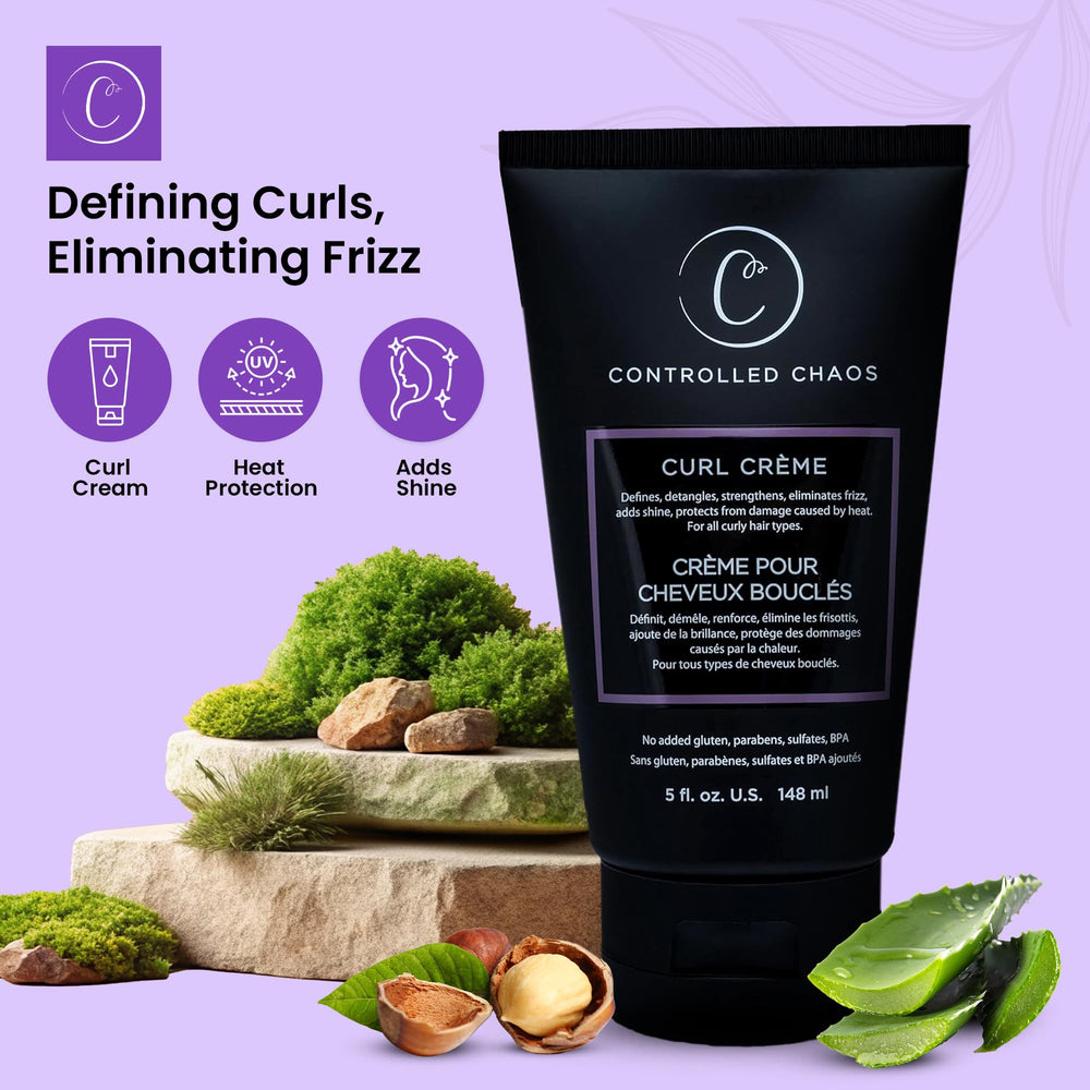 Hands applying Controlled Chaos Curl Cream to damp curls.
