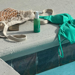 COOLA dermatologist-tested spray with SPF 30 for scalp care.