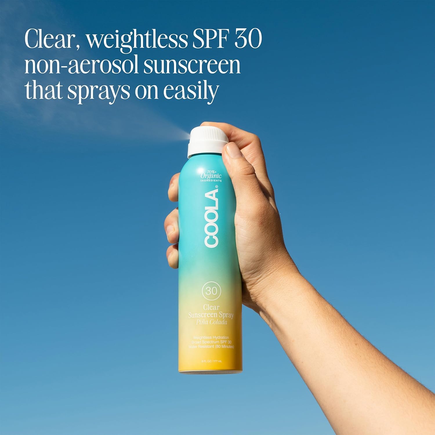 COOLA Piña Colada spray mist covers hard-to-reach areas quickly