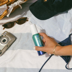 COOLA SPF 50 mist used under makeup for light, comfortable sun protection.
