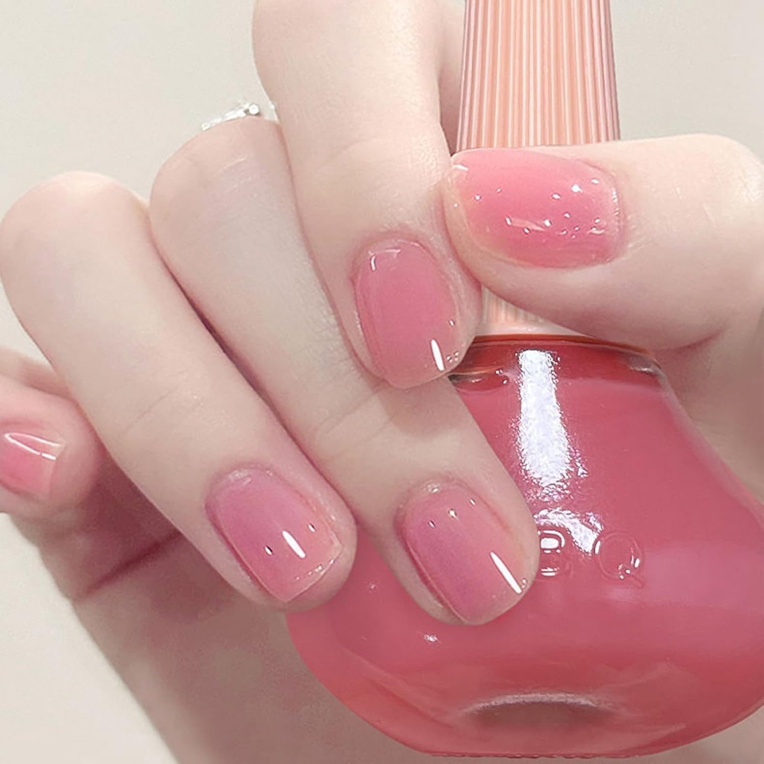 COSMOO Jelly Pink frente de la botella, tono translúcido ideal para arte de uñas.