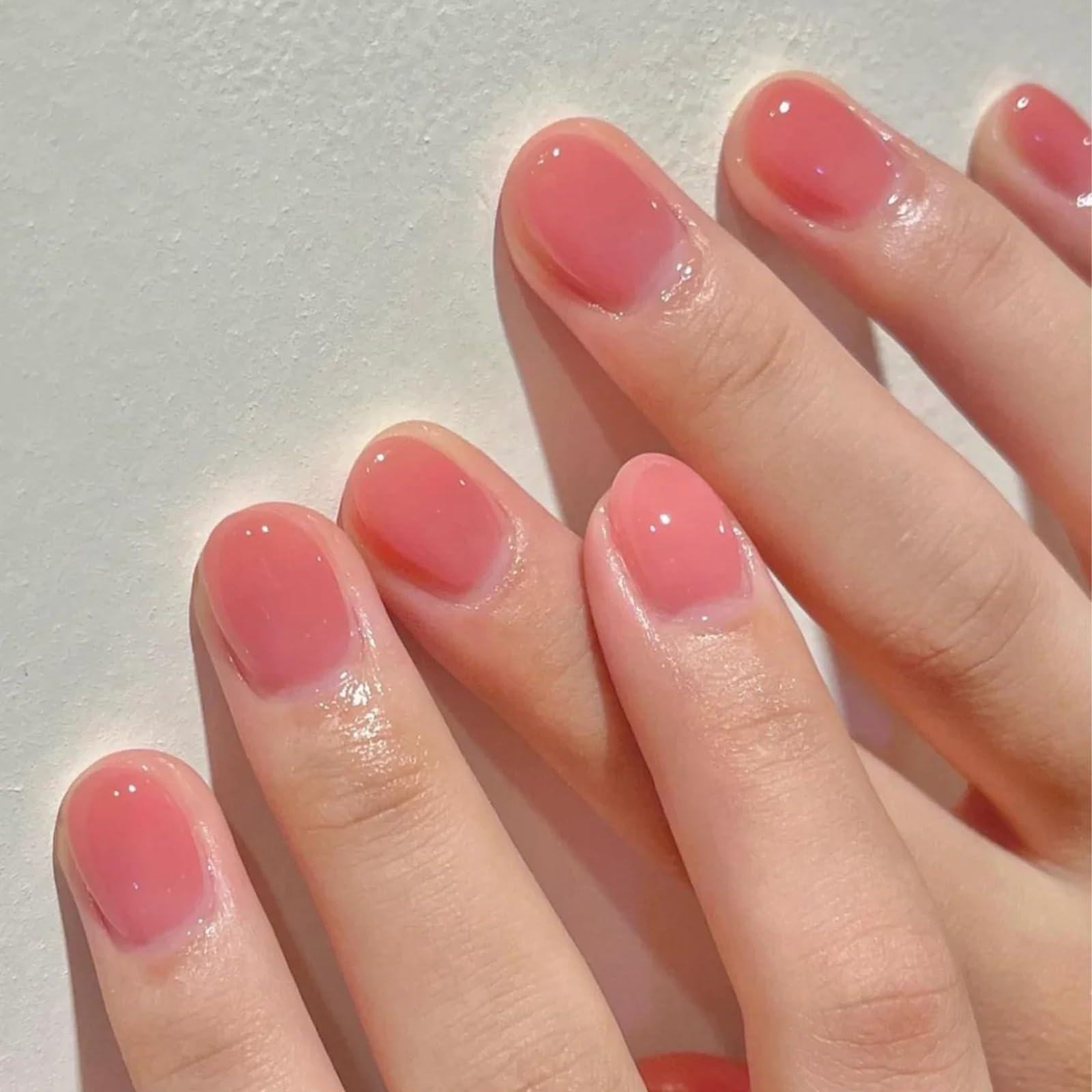 COSMOO Jelly Pink muestra en uñas, color rosado translúcido para diseños en casa.