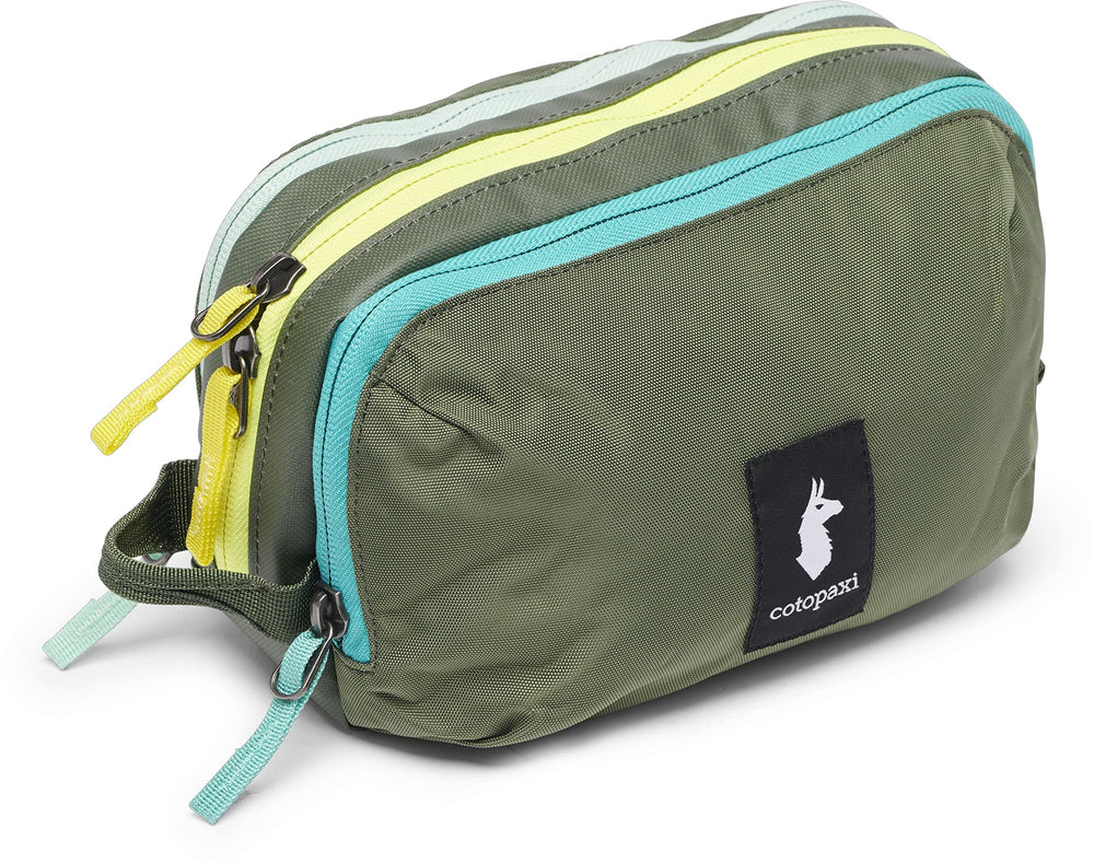 Cotopaxi Nido Accessory Bag showing organized interior compartments for travel essentials.