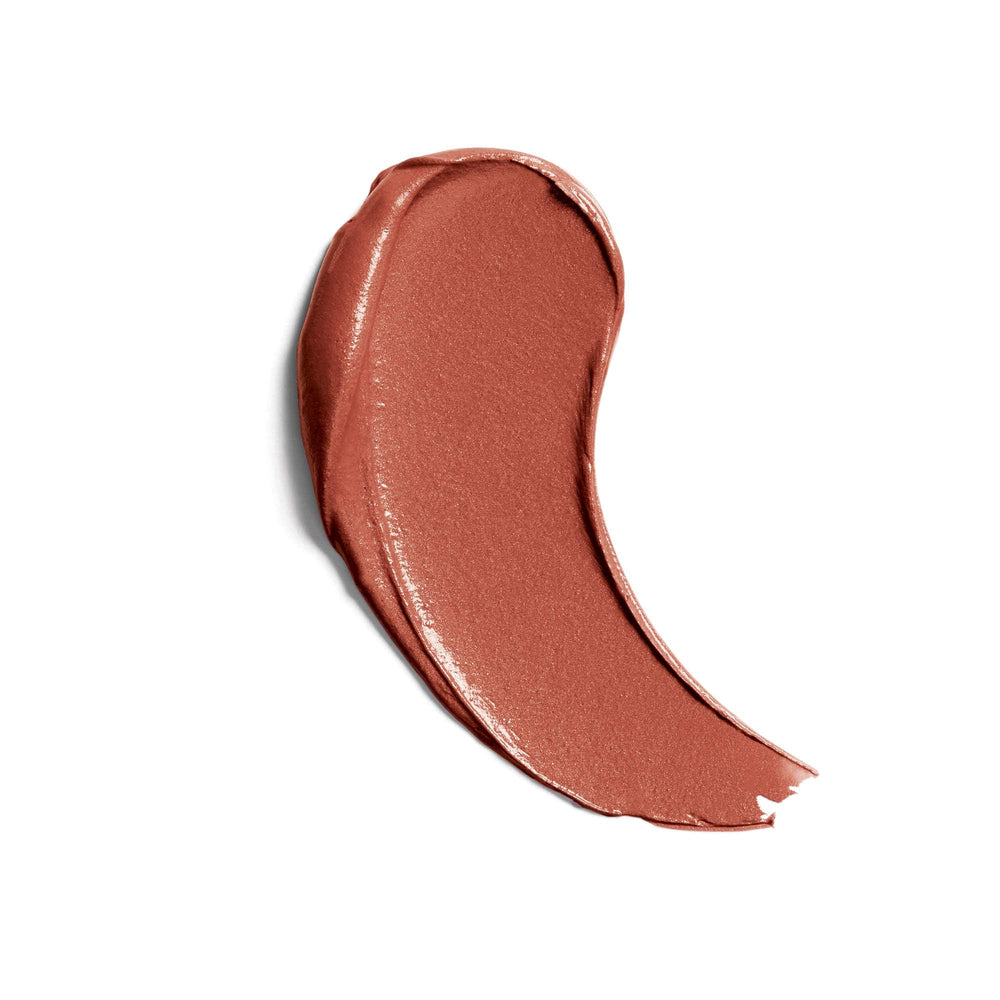 Applying CoverGirl Bronzed Glow for a smooth, comfortable lip look.