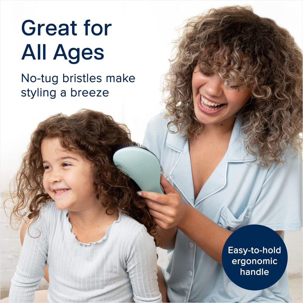 Crave Naturals Glide Thru Detangling Brush compact, travel-ready for on-the-go styling.